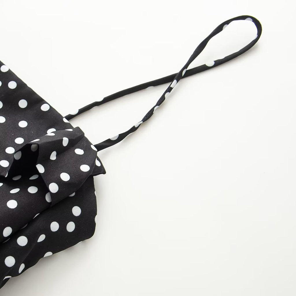 Women's sleeveless polka dot suspender dress