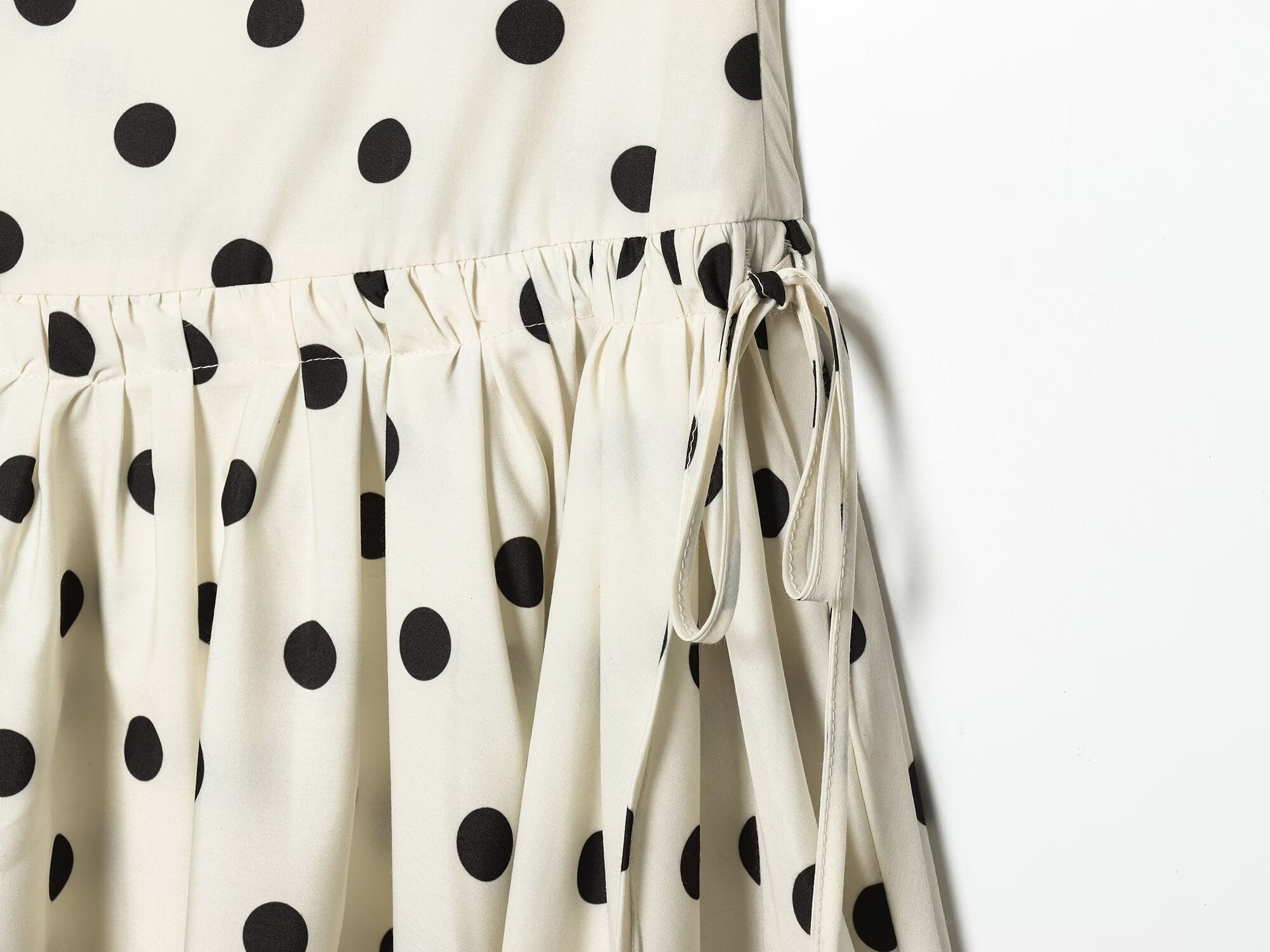 Women's asymmetrical polka dot MIDI skirt