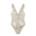 Women's lace decorated satin textured bodysuit